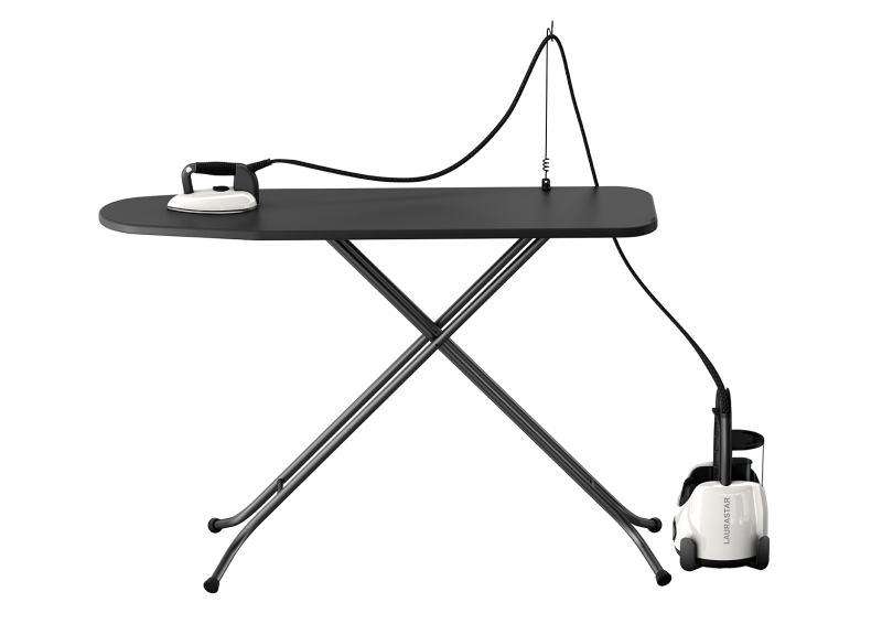 Laurastar Lift Pure white in use on ironing board with steam cord holder